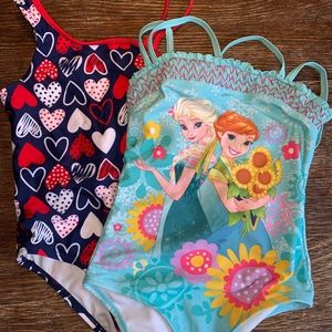 Lot of 2 Girl's one piece swim suits. Size 5.